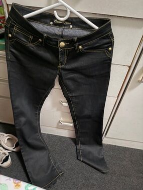 everytime tuck in tuck out neat yellow stitch yellow gold ish button jeans pants